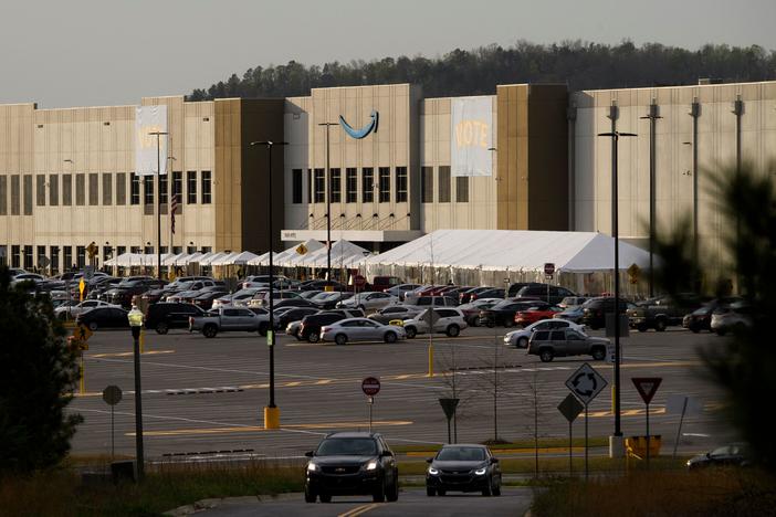 Signs reading "vote" hang outside the Amazon warehouse in Bessemer, Ala., in March as workers wrapped up their seven-week mail-in election on whether to unionize.