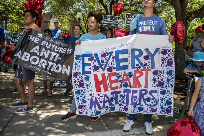 Anti-abortion-rights protesters come out in May to the Texas Capitol in Austin in response to a bill that Gov. Greg Abbott signed outlawing abortions after a fetal heartbeat is detected.
