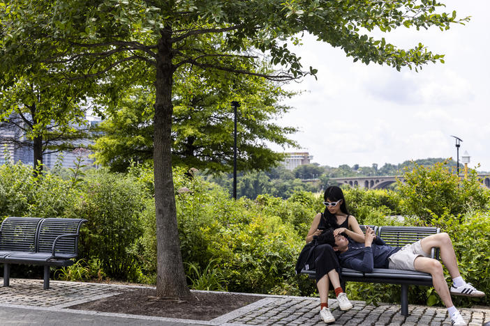 People relax at the Georgetown Waterfront Park on Monday in Washington, D.C. While pandemic restrictions have been lifted for much of the country, the Delta variant of COVID-19 is hospitalizing thousands of people in the U.S. who have so far not gotten a vaccine.