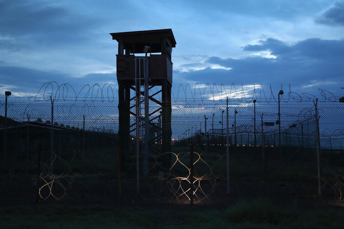 Razor wire and a guard tower stands at a closed section of the U.S. prison at Guantánamo Bay on Oct. 22, 2016.