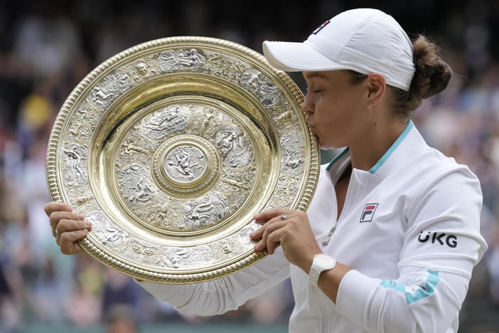 Australia's Ashleigh Barty poses with the winner's trophy on Saturday after winning the Wimbledon women's singles final against the Czech Republic's Karolina Pliskova.