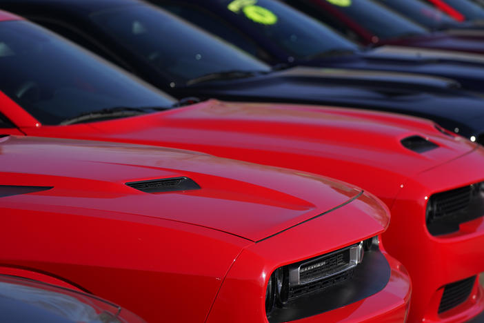 Used Challengers sit in a long line at a Dodge dealership on Jan. 24 in Littleton, Colo. Used car prices may be peaking and that could help reinforce hopes for easing inflation.