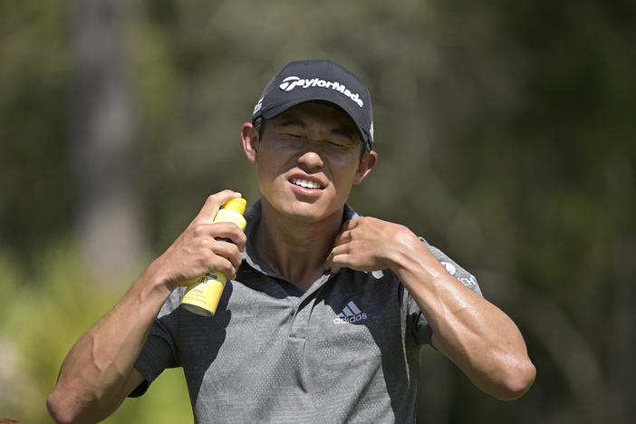 Johnson & Johnson recalled five aerosol sunscreen products after finding traces of benzene. In this photo, Collin Morikawa sprays himself with sunscreen during the Workday Championship golf tournament in February.