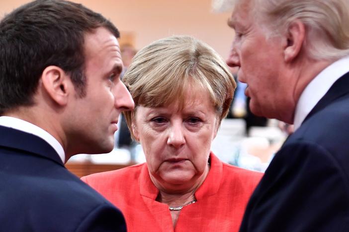 German Chancellor Angela Merkel with then-President Donald Trump and French President Emmanuel Macron at the start of the G-20 meeting in Hamburg, Germany, in July 2017.