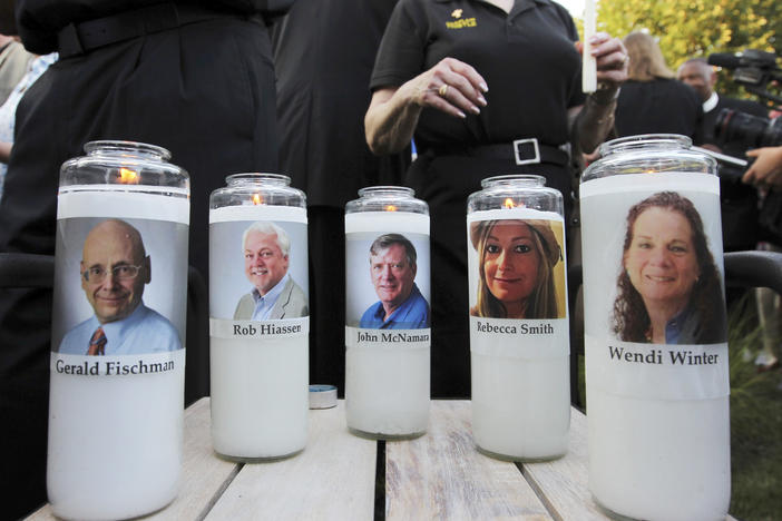 Five employees of the <em>Capital Gazette</em> newspaper are honored across the street from the newsroom where they were killed in Annapolis, Md.