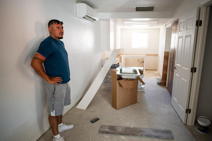 Joshua Ray, a social worker with the Scotts Valley Band of Pomo Indians, inside one of the apartments of the building tribal leaders bought in Lakeport, Calif., through Homekey.