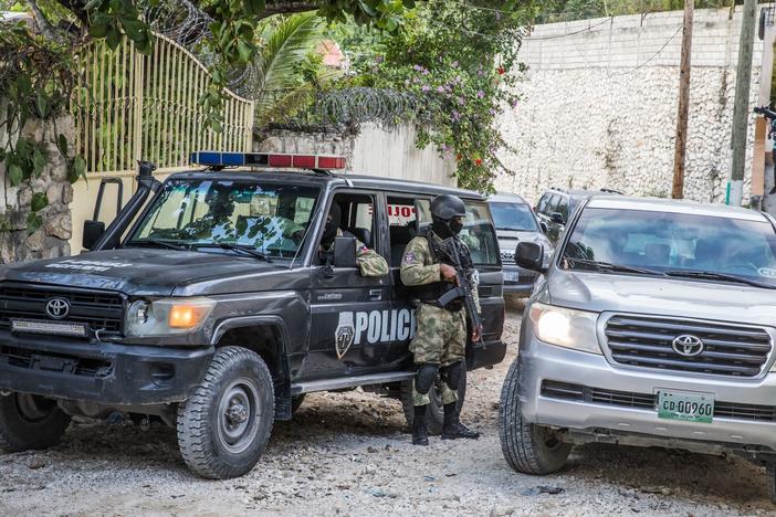 Police stand guard Thursday outside the residence of the late Haitian President Jovenel Moïse in Port-au-Prince after his assassination last week.