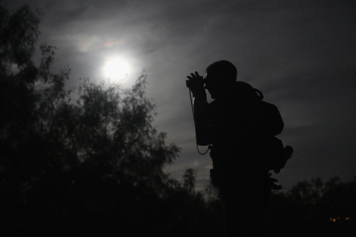A U.S. Border Patrol agent uses night vision goggles near Roma, Texas in August 2016. More than 100 such devices have gone missing from the Fort Hood Army post near Killeen, Texas.
