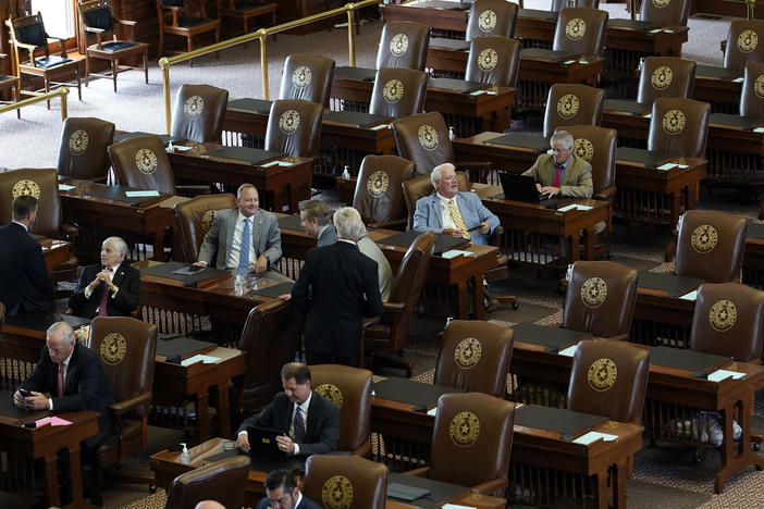 Empty seats are seen in the House Chamber at the Texas Capitol, Tuesday, July 13, 2021, in Austin, Texas. Texas Democrats left the state to block sweeping new election laws, while Republican Gov. Greg Abbott threatened them with arrest the moment they return.