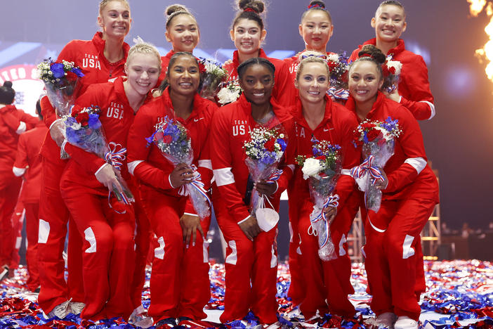The women representing Team USA, including six team members and four alternates, pose last month after the U.S. Gymnastics Olympic trials in St. Louis. Kara Eaker, an alternate, has tested positive for the coronavirus, her gym says.