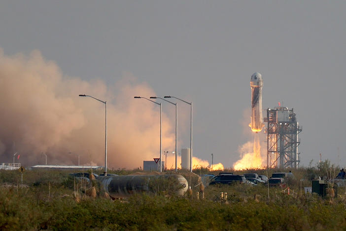 Blue Origin's New Shepard rocket lifts off from the launch pad Tuesday morning in Van Horn, Texas.