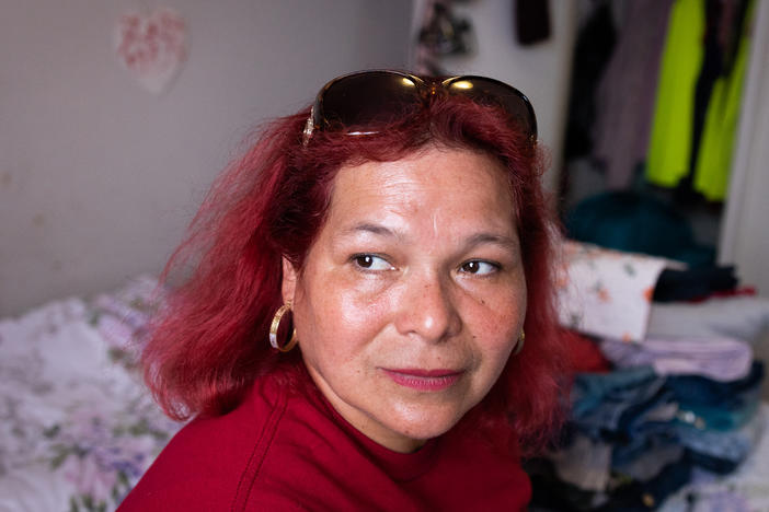 María Lara sits in her bedroom in the Bedford and Victoria Station apartment complex in Langley Park, Md., a densely populated, low-income suburb of Washington, D.C.