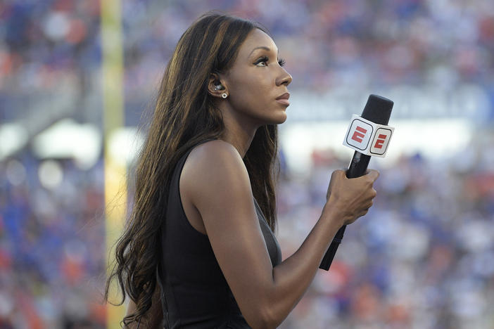 ESPN's Maria Taylor works from the sidelines during an NCAA college football game between Miami and Florida in 2019. ESPN announced Wednesday that Taylor is leaving the network.