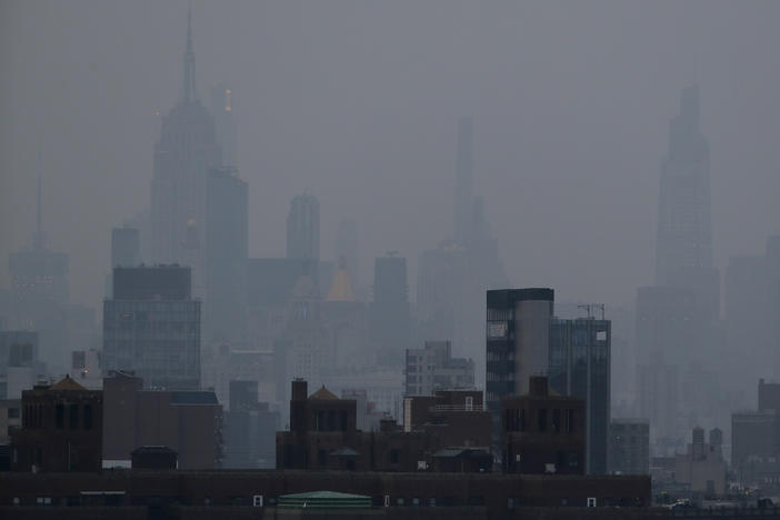 A thick haze hangs over Manhattan on Tuesday. Wildfires in the West, including the Bootleg Fire in Oregon, are creating hazy skies and poor air quality as far away as the East Coast.