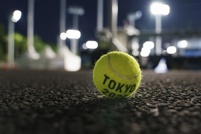 A ball sits outside a court at the Ariake Tennis Park during practice sessions at the Tokyo Olympics on Tuesday.