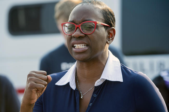 Nina Turner, a candidate running in a special Democratic primary for Ohio's 11th Congressional District, speaks with supporters near the Cuyahoga County Board of Elections in Cleveland before casting her early vote on July 7.