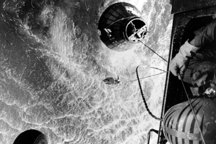 A U.S. Marines helicopter hovers over the Atlantic ocean during an attempt to retrieve astronaut Gus Grissom's Liberty Bell 7, which sank 15,000 feet shortly after splashdown on July 21, 1961.