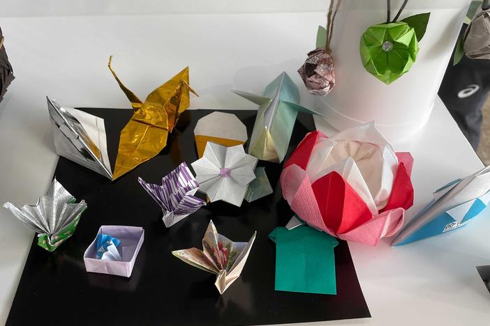 Volunteers at the center for media at the Tokyo Olympics made origami designs, including cranes and flowers.