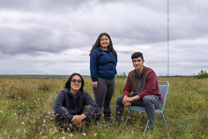 High schoolers Ethan Lincoln, Kaylee King and Jamin Crow's podcast about their experiences subsistence hunting is a finalist in the NPR Student Podcast Challenge. The students are pictured here at the KYUK radio transmitter site in Bethel, Alaska.