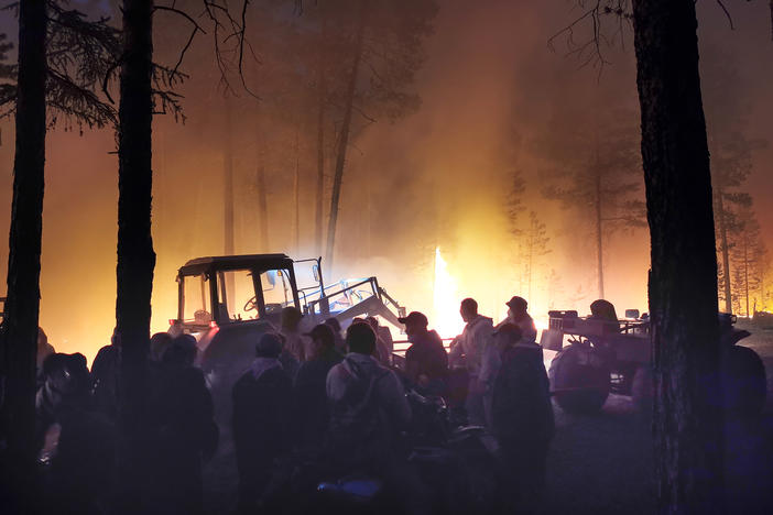 Volunteers fight a wildfire in northeastern Siberia on July 17th. Heat waves in the Russian Arctic and boreal forests have fueled intense, widespread blazes that can damage trees and release enormous amounts of stored carbon dioxide from forests and permafrost.