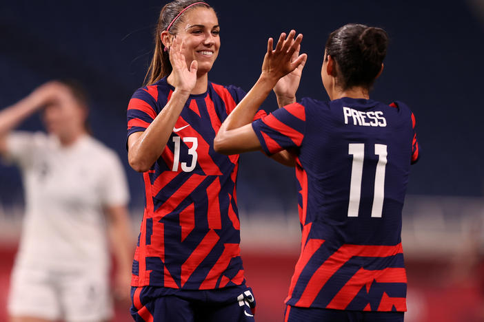 Alex Morgan (#13) celebrates another Team USA goal against New Zealand with teammate Christen Press (#11) at the Tokyo Olympics on Saturday in Saitama, Japan.