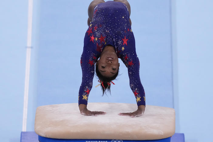 U.S. gymnastics star Simone Biles performs on the vault during the women's artistic gymnastic qualifications on Sunday at the 2020 Summer Olympics in Tokyo.