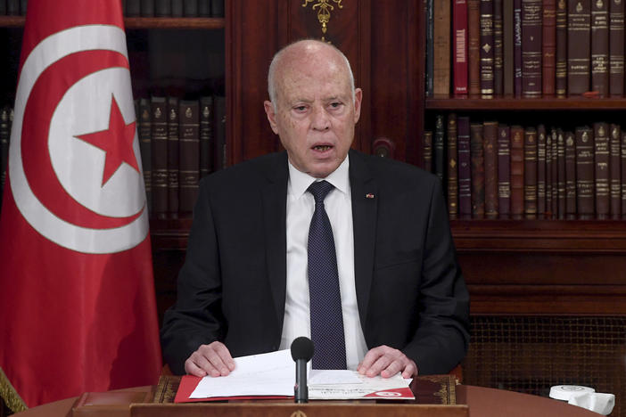 Tunisia's President Kais Saied leads a security meeting with members of the army and police forces in Tunis, Tunisia, on Sunday. Troops surrounded the parliament building and blocked its speaker Rached Ghannouchi from entering Monday after the president suspended the legislature and fired the prime minister following nationwide protests.