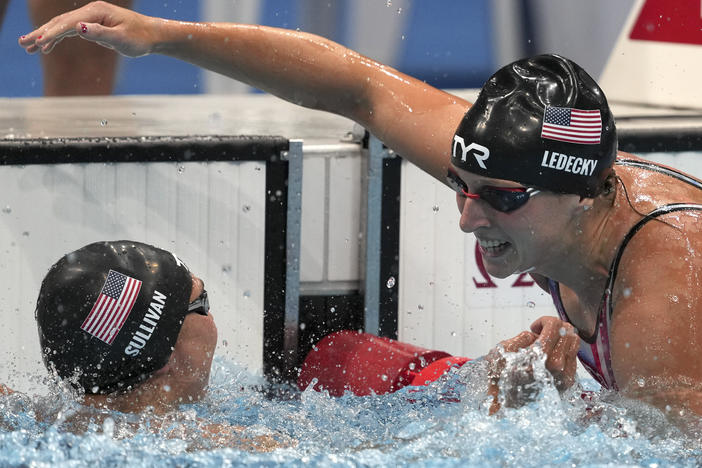 U.S. swimmer Katie Ledecky embraces teammate Erica Sullivan after winning the women's 1,500 meter freestyle.