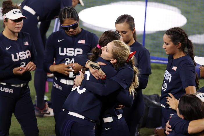 Haylie McCleney #8 hugs Catherine Osterman #38 of Team United States after losing to Team Japan 2-0 in the Softball Gold Medal Game on day four of the Tokyo 2020 Olympic Games.