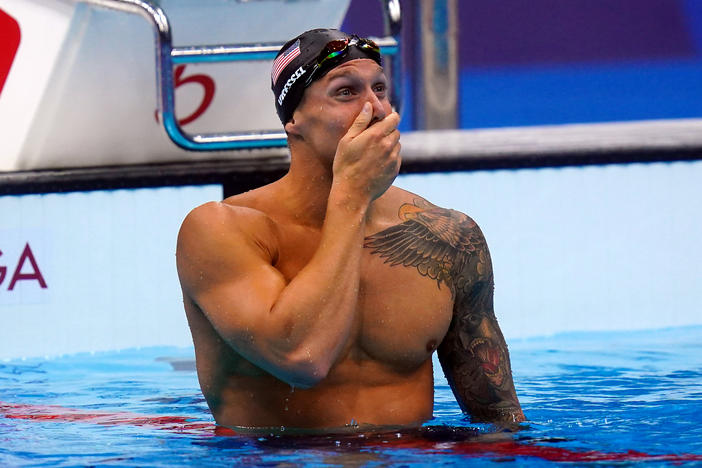 U.S. swimmer Caeleb Dressel celebrates after he wins the men's 100 meter freestyle final at the Tokyo Olympics on Thursday.