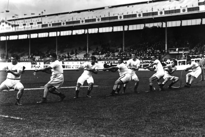 The Unites States tug-of-war team in action during the 1908 London Olympics at White City Stadium.