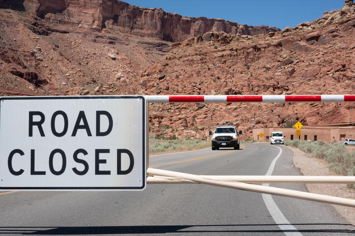 The gate to Arches National Park is closed on a weekday morning last month, as it is many mornings after the parking lots and trails quickly fill up.
