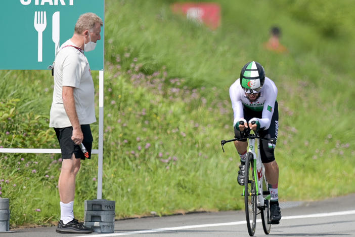 Patrick Moster was fired from his job as sports director of the BDR, the German Cycling Federation after yelling slurs during a race Wednesday. Here, Moster stands next to the track next to cyclist Azzedine Lagab from Algeria — one of the riders a German cyclist was attempting to catch.