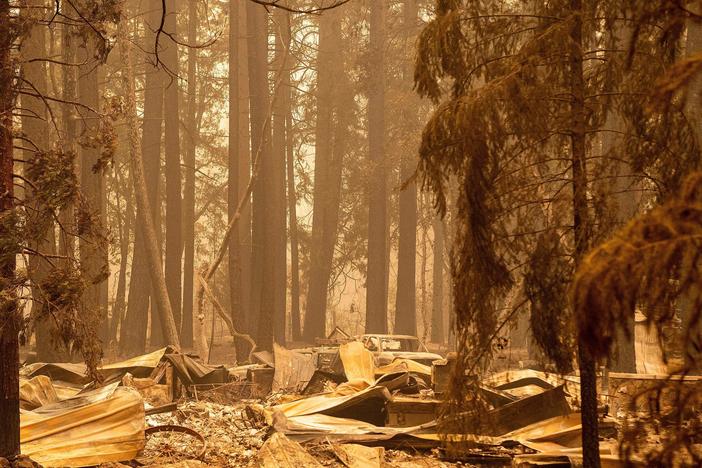 The remains of a burned home are seen in the Indian Falls neighborhood of unincorporated Plumas County, California on July 26, 2021. Extreme weather events have claimed hundreds of lives worldwide in recent weeks, and upcoming forecasts for wildfire and hurricane seasons are dire.