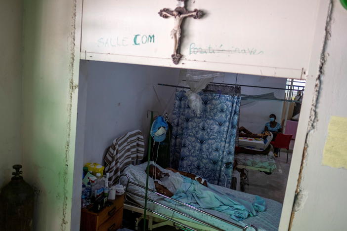 COVID-19 patients receive treatment at the St. Luke Foundation for Haiti hospital in Port-au-Prince, Haiti, on July 16. The country received its first shipment of COVID-19 vaccine doses that month.