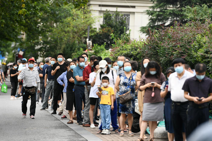People line up for coronavirus testing on Thursday in Nanjing, in China's Jiangsu province.