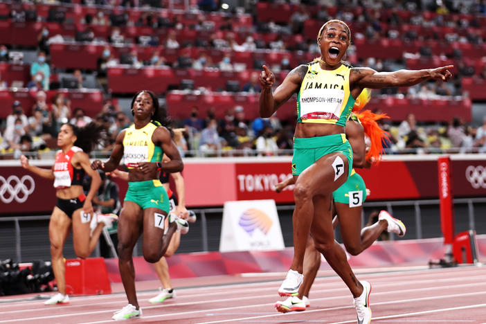 Elaine Thompson-Herah of Team Jamaica crosses the finish line to win the gold medal in the women's 100-meter final at the Tokyo Olympic Games on Saturday.