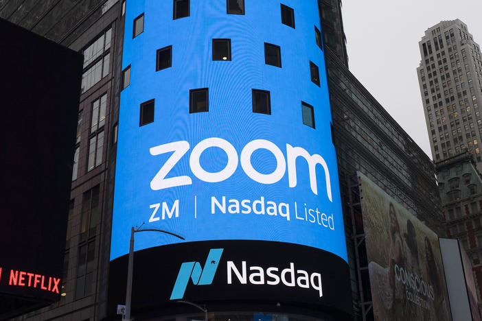 A sign for Zoom Video Communications is pictured ahead of the company's Nasdaq IPO in New York in 2019. The company has agreed to a preliminary settlement in a privacy lawsuit.