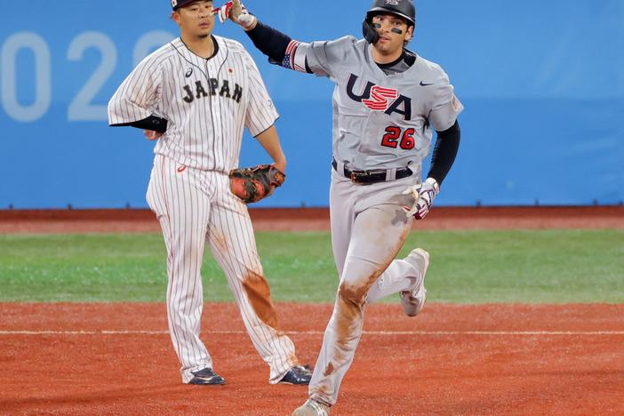Team USA's Triston Casas trots the bases Monday after hitting a three-run homer against Japan as Hideto Asamura watches. Japan came back to defeat the U.S. 7-6 in extra innings at the Tokyo Olympics.