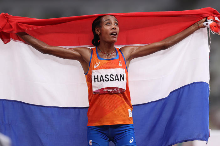 Sifan Hassan of Team Netherlands celebrates as she walks the track with her country's flag after winning the gold medal in the women's 5,000 meter final on Day 10 of the Tokyo Games.