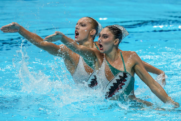 Greece's Evangelia Papazoglou and Evangelia Platanioti compete Monday in the preliminary for the duet free artistic swimming event in Tokyo. Their hopes are now dashed after Greek officials said the team will not participate in the group or duet artistic swimming events.