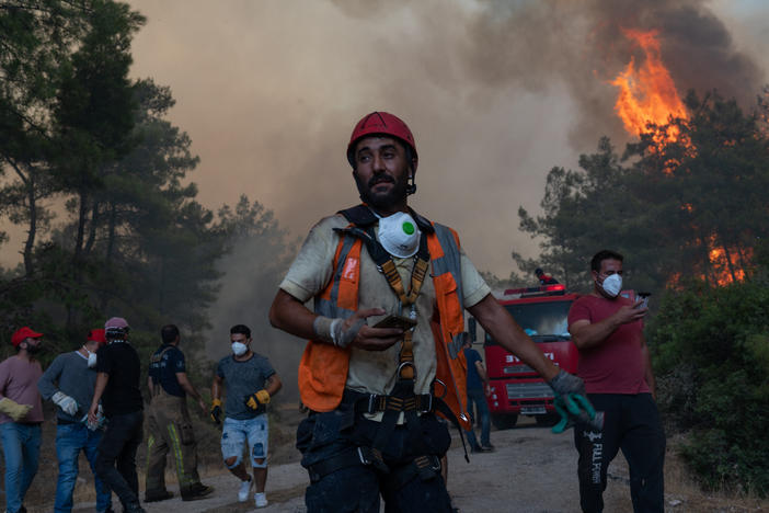 Firefighters battle a wildfire on August 2 in Mugla, Marmaris district. The European Union sent help to Turkey and volunteers joined firefighters in battling a week of violent blazes that have killed eight people.