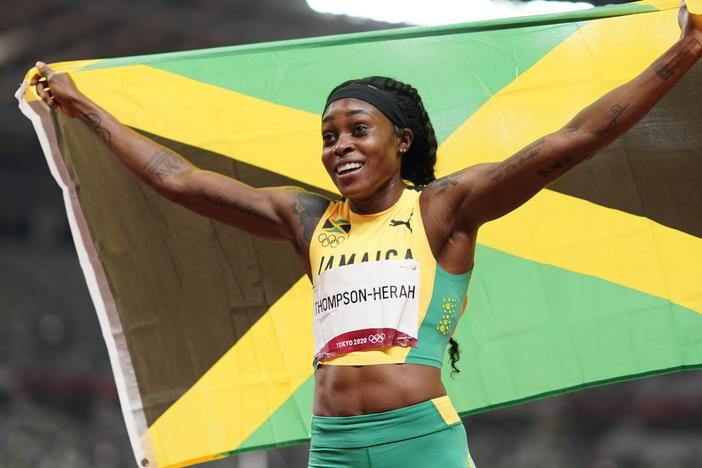 Elaine Thompson-Herah, of Jamaica, reacts after winning the final of the women's 200-meters at the 2020 Summer Olympics, Tuesday, Aug. 3, 2021, in Tokyo.