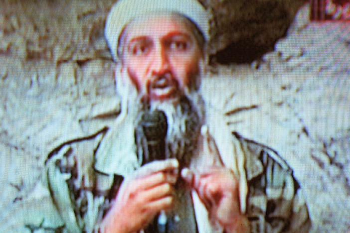 Osama bin Laden is seen at an undisclosed location in a television image broadcast on Oct. 7, 2001.