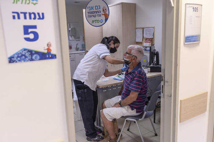 The director of WHO now says that a booster moratorium should be in force until 10% of the population in all countries is vaccinated. Israel had previously announced plans to give a third Pfizer dose to residents age 60 and up after an uptick in COVID cases. Above: Administering a booster on August 2 in Tel Aviv.