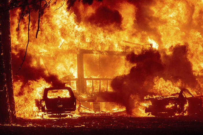 Flames consume a home on Highway 89 as the Dixie Fire tears through the Greenville community of Plumas County, Calif., on Wednesday, Aug. 4, 2021.