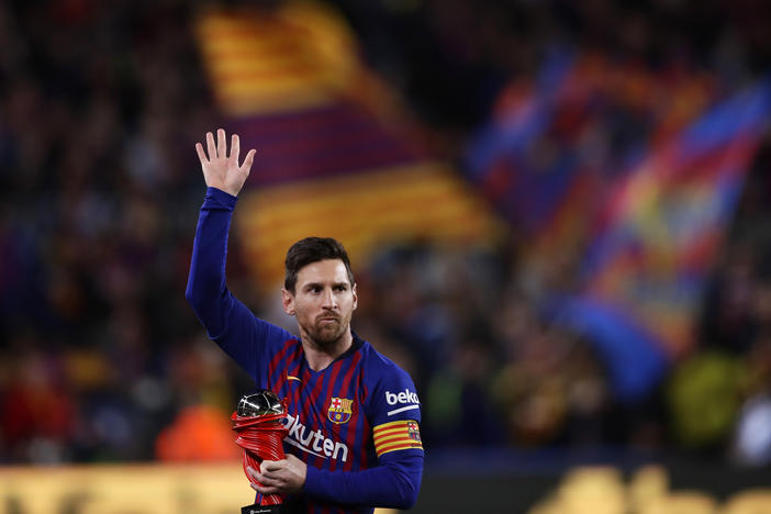 Lionel Messi waves at a Barcelona crowd in 2019. Barcelona says Lionel Messi will not stay with the club.