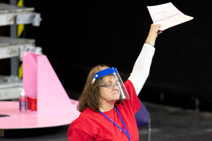 A contractor works to recount ballots from the 2020 general election in Phoenix on May 1. The Maricopa County, Ariz., ballot recount came after two election audits found no evidence of widespread fraud in Arizona.