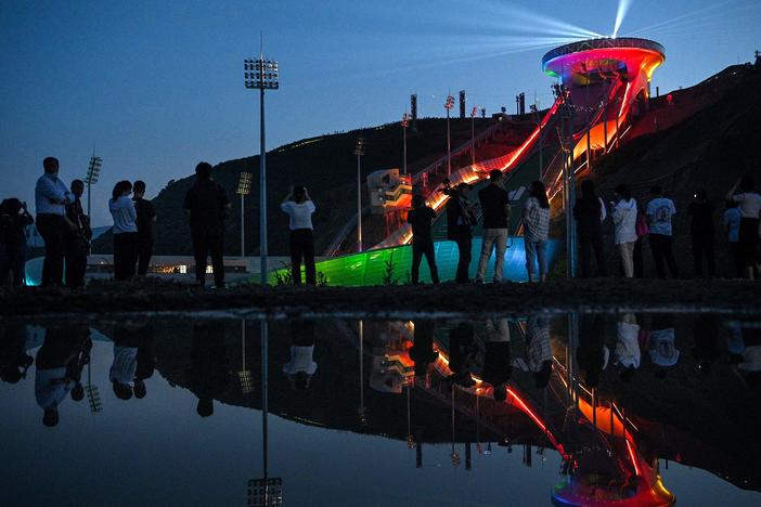 The Beijing Winter Olympics are set to open in February. Visitors recently watched a light show at the newly built ski jumping center in northern China's Hebei province.