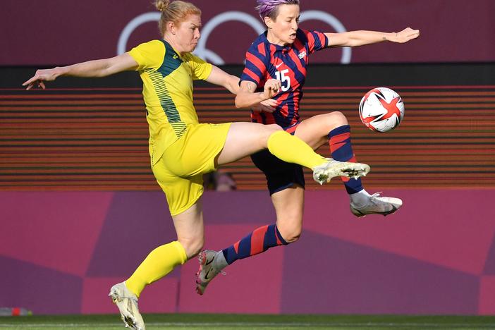 Australia's defender Clare Polkinghorne (left) fights for the ball with Team USA forward Megan Rapinoe during the women's bronze medal soccer match on Thursday at the Tokyo Olympics.